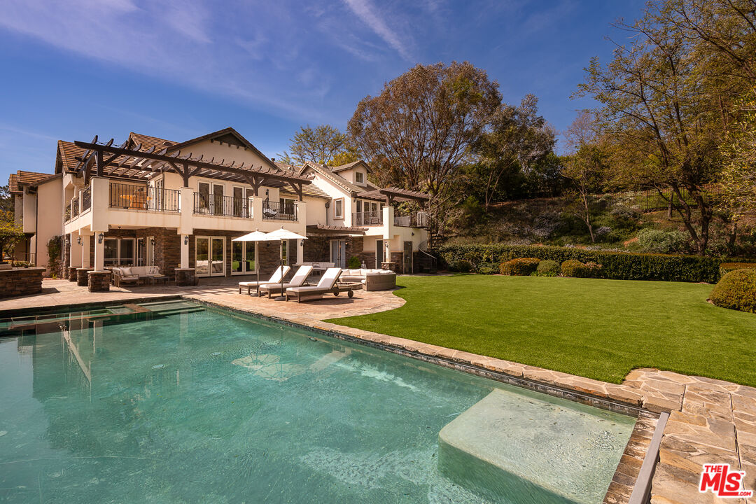 23575 Parksouth Street Calabasas, CA 91302 - Photo 68 of 75 a view of a house with a big yard and sitting area