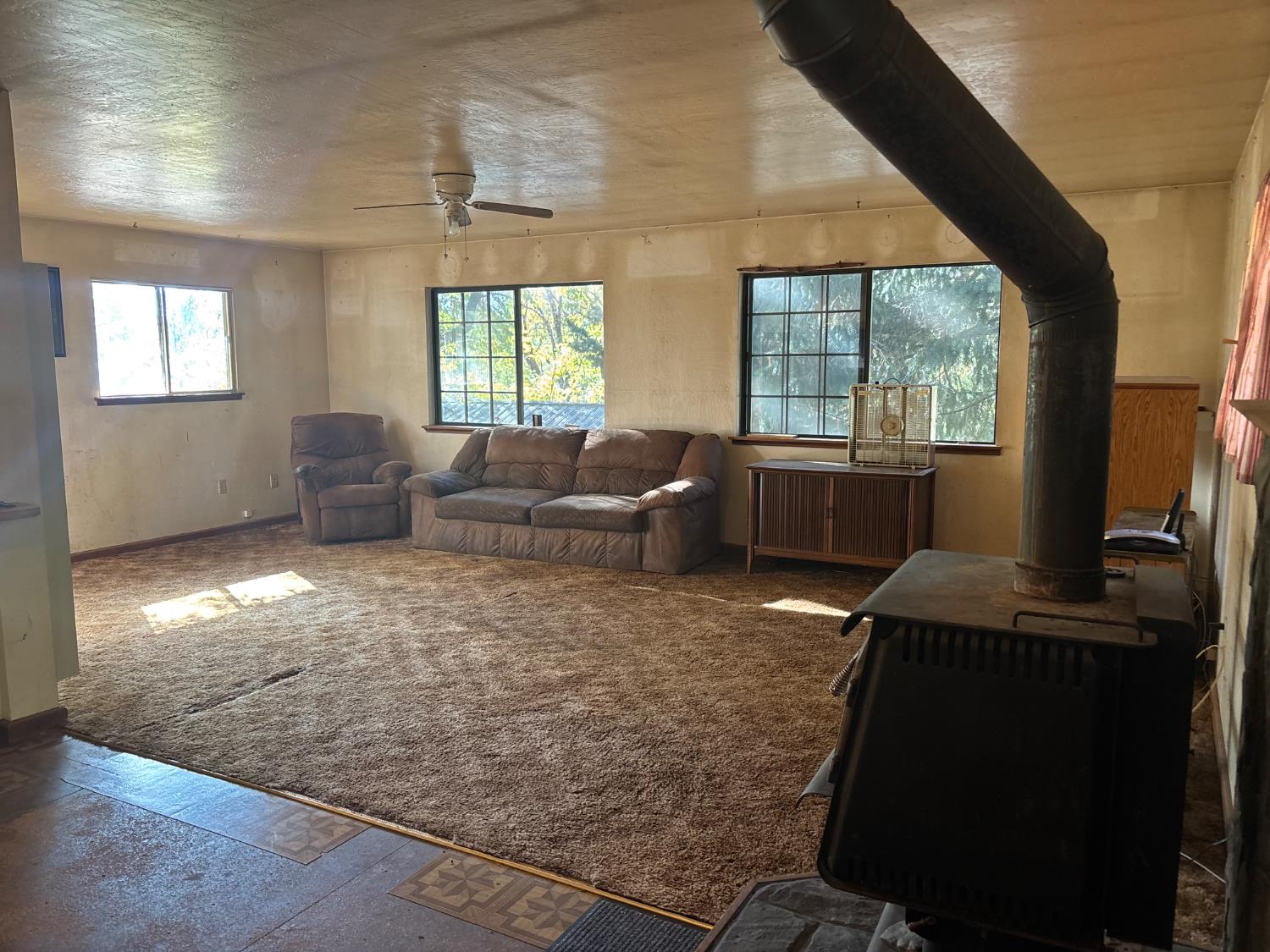 15574 Hinton Road Pioneer, CA 95666 - Photo 35 of 44 a living room with furniture and a flat screen tv