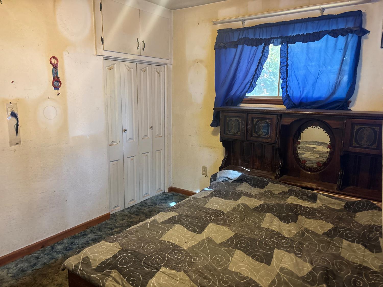 15574 Hinton Road Pioneer, CA 95666 - Photo 42 of 44 a bedroom with a bed and a closet