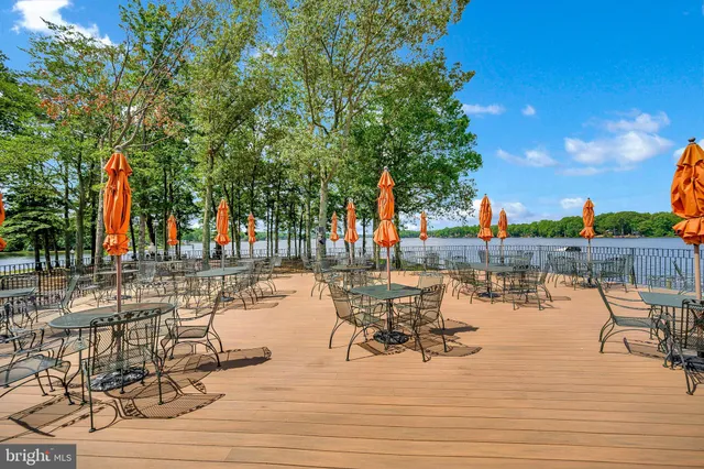 a view of a lake with outdoor seating space