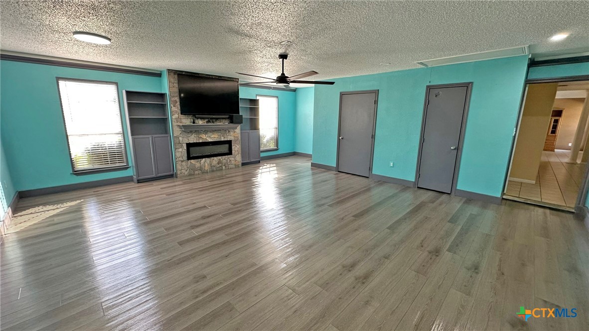 729 Armadillo Lane Kempner, TX 76539 - Photo 18 of 45 wooden floor in an empty room with a window