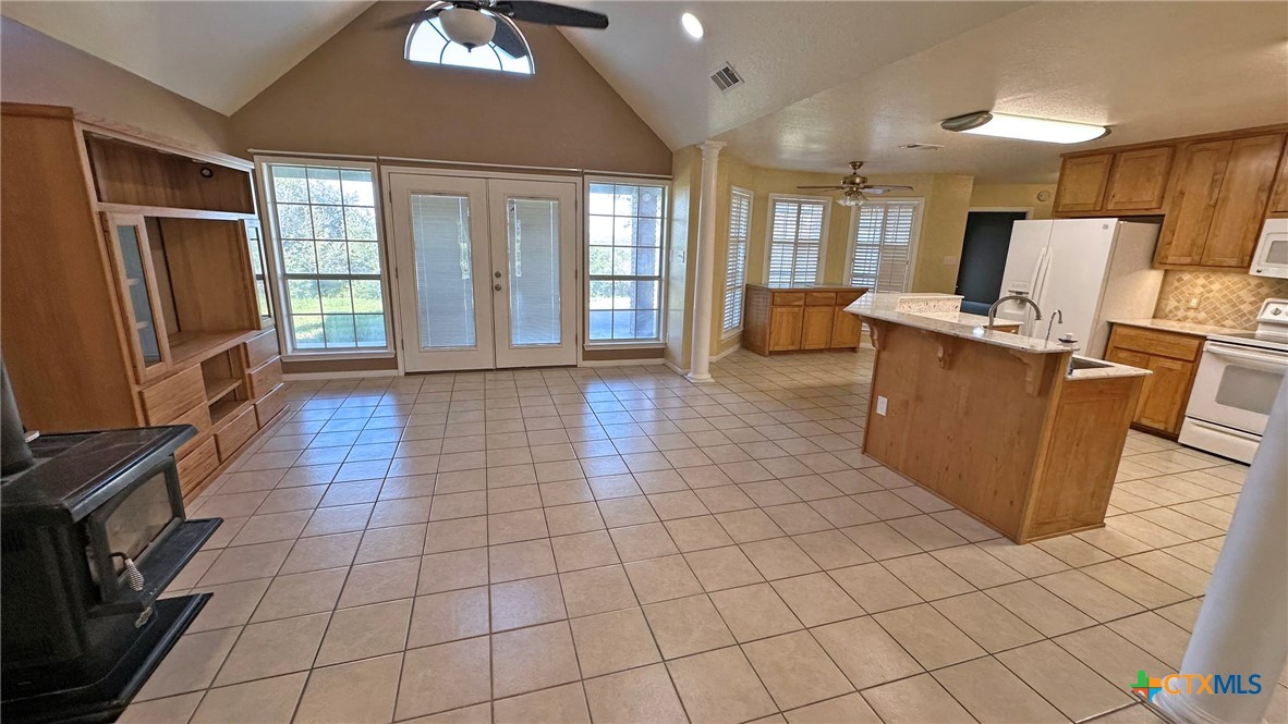 729 Armadillo Lane Kempner, TX 76539 - Photo 8 of 45 a view of a kitchen with furniture a flat screen tv and windows