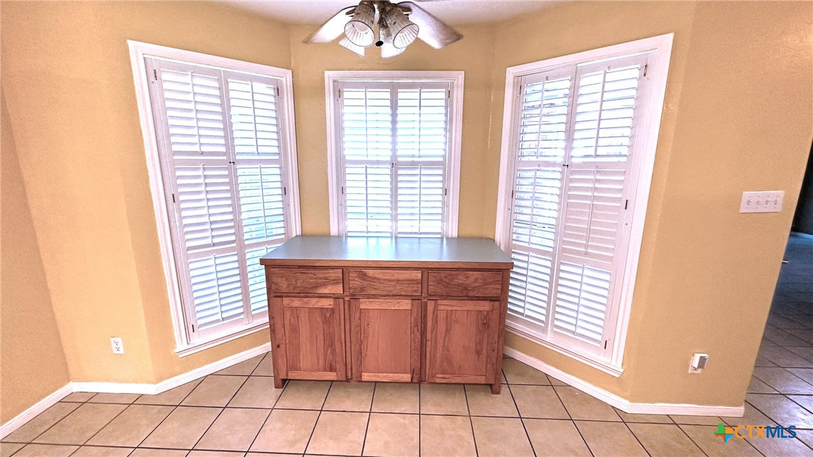 729 Armadillo Lane Kempner, TX 76539 - Photo 10 of 45 a kitchen with stainless steel appliances granite countertop a refrigerator and a sink