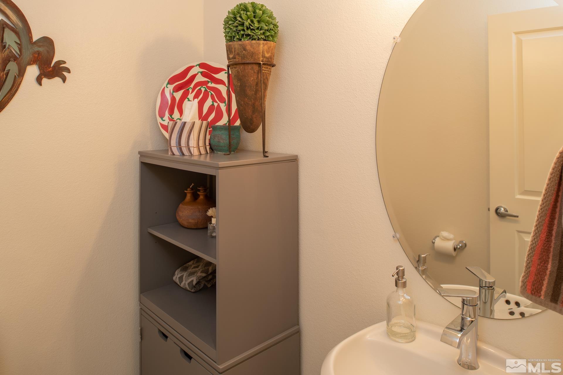575 Logan Jacob Lane Reno, NV 89503 - Photo 14 of 31 a bathroom with a sink and mirror