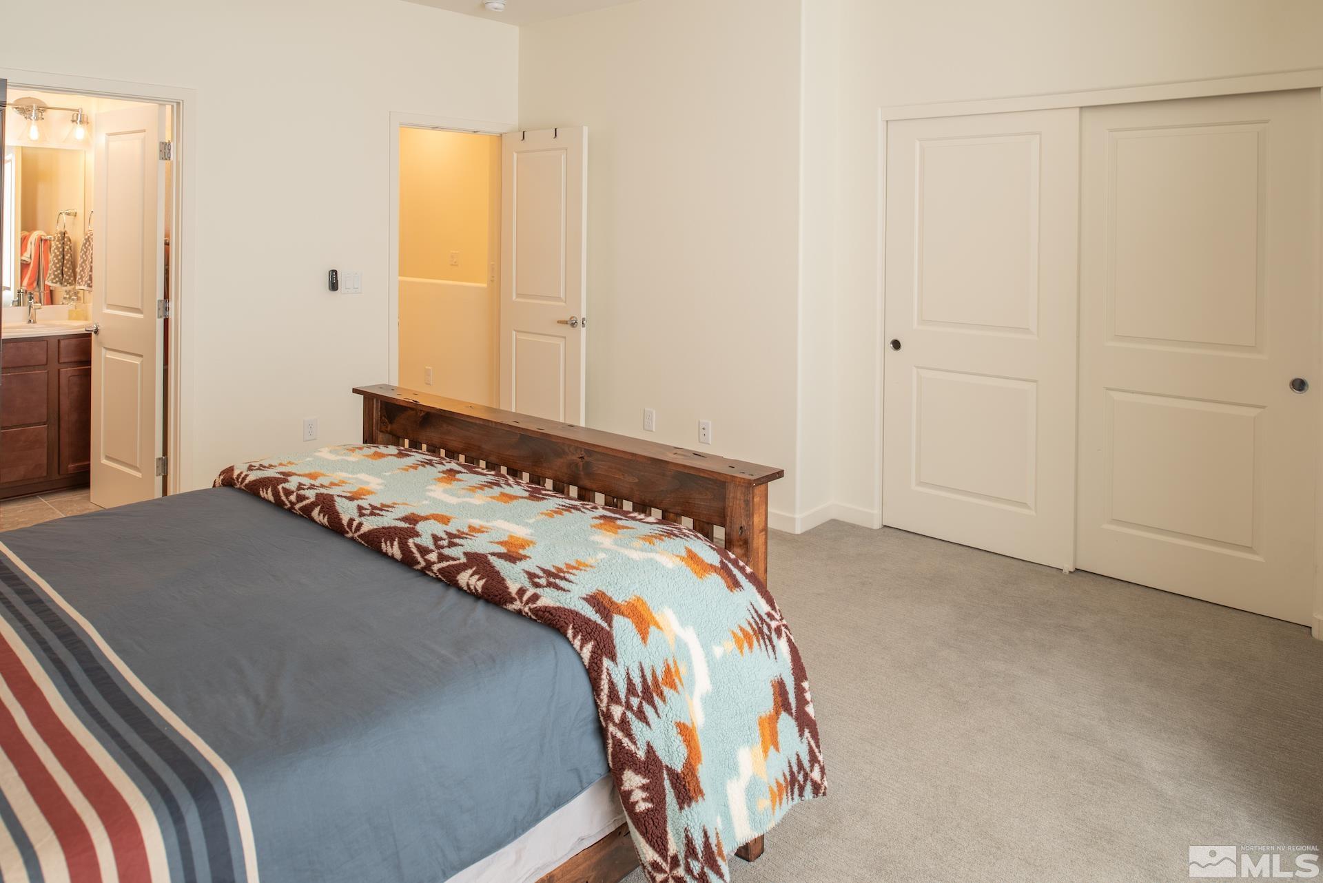 575 Logan Jacob Lane Reno, NV 89503 - Photo 16 of 31 a bedroom with a bed and a cabinets