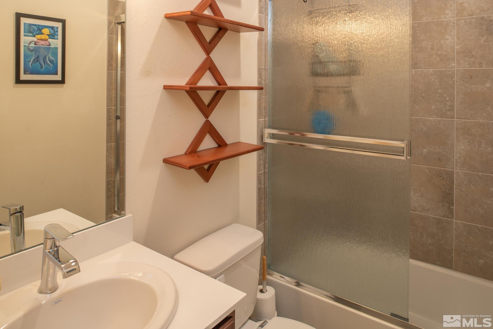 575 Logan Jacob Lane Reno, NV 89503 - Photo 20 of 31 a bathroom with a sink a toilet and a shower