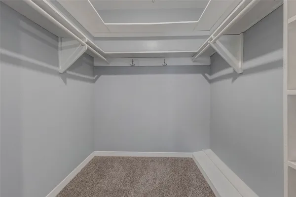 a view of an empty walk in closet