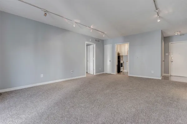 a view of an empty room and closet