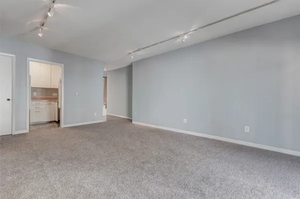 a kitchen with appliances cabinets and a sink