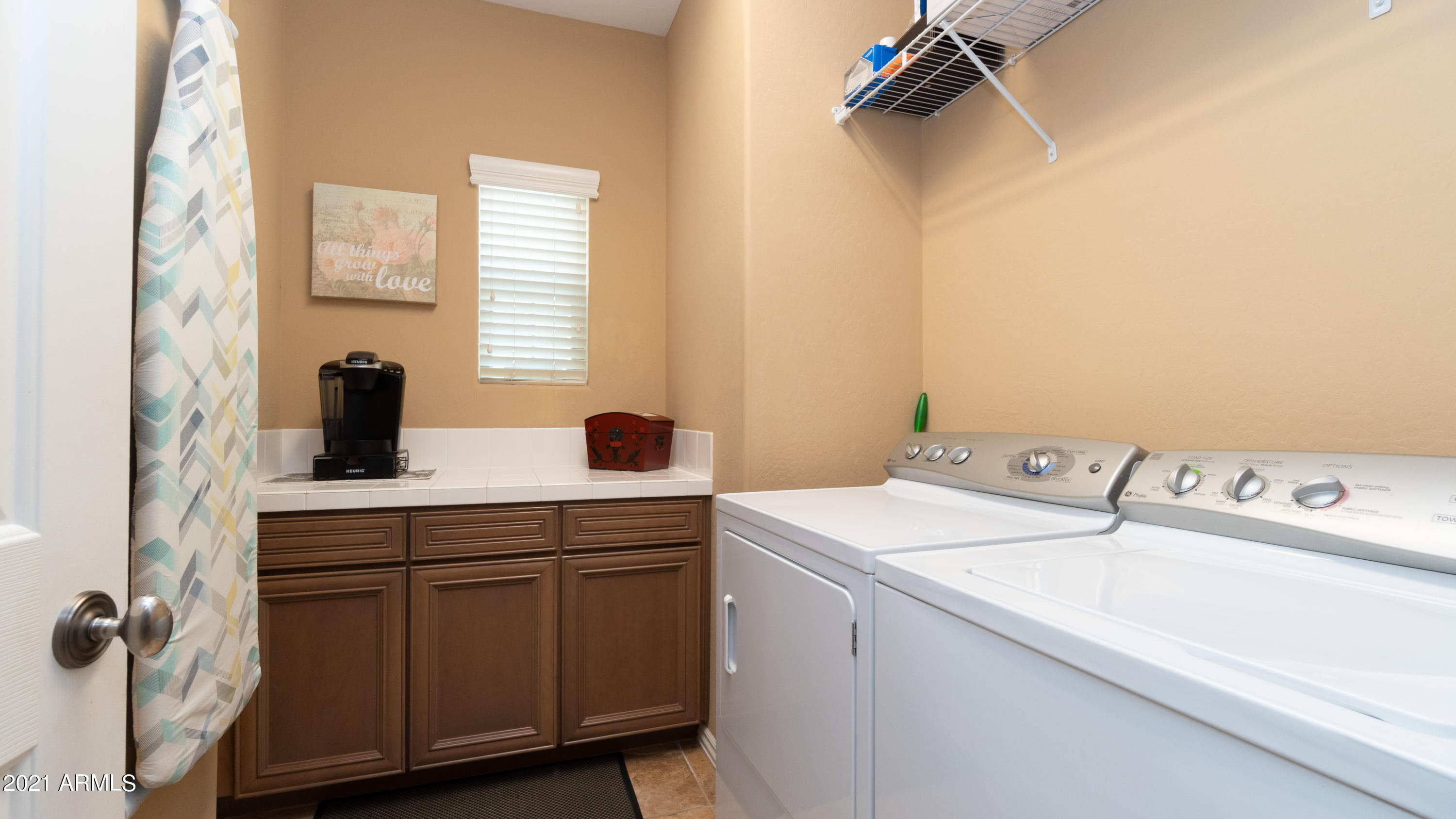 3935 East Rough Rider Road, Unit 1228 Phoenix, AZ 85050 - Photo 26 of 62 Laundry Room with Full Size W/D