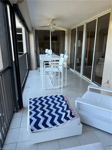 a living room with furniture and large rug