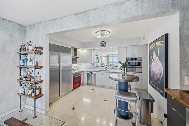 a large building with a clock tower in front of it