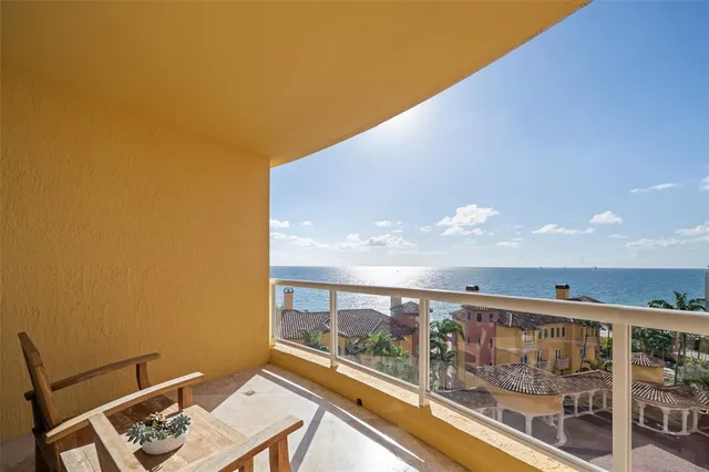 a kitchen with stainless steel appliances kitchen island granite countertop a refrigerator a stove and a sink