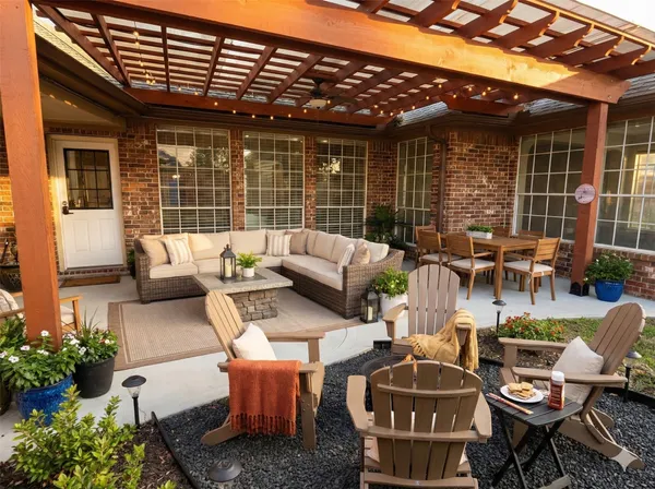 a backyard of a house with outdoor seating