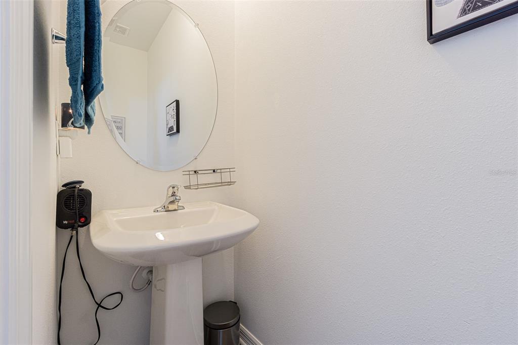 5265 Cricket Hill Road Brooksville, FL 34602 - Photo 11 of 30 a bathroom with a sink and a mirror