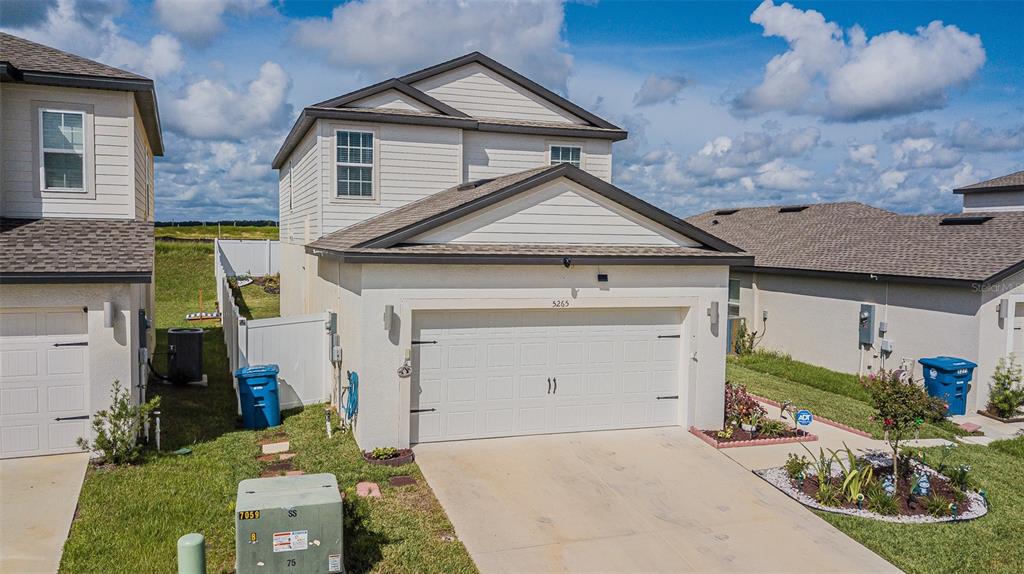 5265 Cricket Hill Road Brooksville, FL 34602 - Photo 2 of 30 a front view of a house with garden