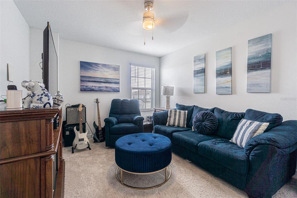 5265 Cricket Hill Road Brooksville, FL 34602 - Photo 26 of 30 a living room with furniture and a window