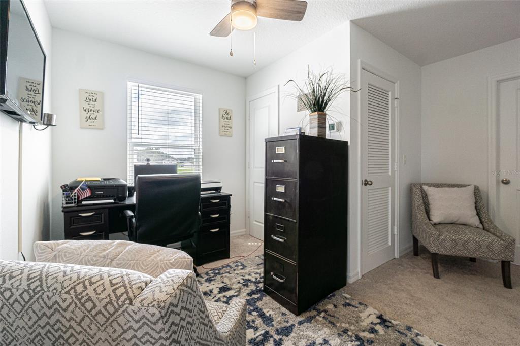 5265 Cricket Hill Road Brooksville, FL 34602 - Photo 27 of 30 a bedroom with a bed dresser and a window