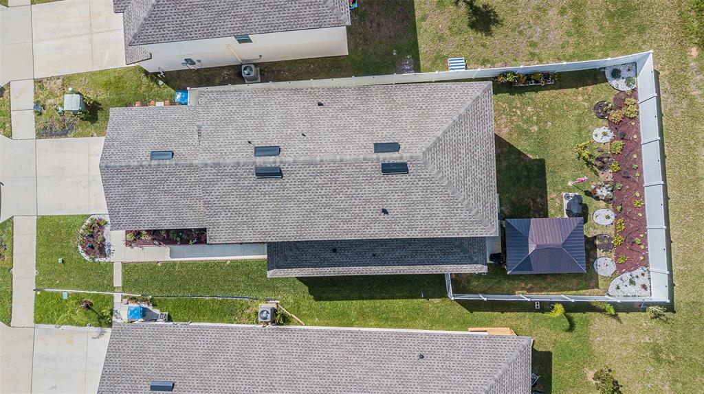 5265 Cricket Hill Road Brooksville, FL 34602 - Photo 3 of 30 a aerial view of a house with a yard and a large pool