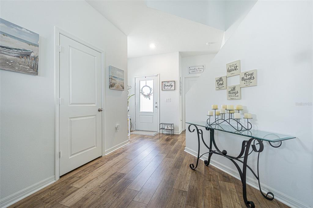 5265 Cricket Hill Road Brooksville, FL 34602 - Photo 10 of 30 a view of a room with furniture and wooden floor
