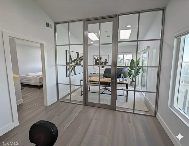 a view of a livingroom with furniture and hardwood floor