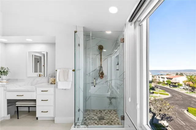 a bathroom with a shower and a sink