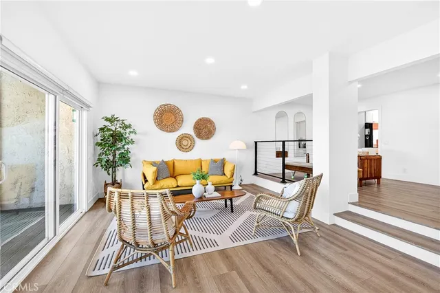 a work room with furniture and wooden floor