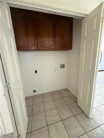 a view of a utility room with wooden floor