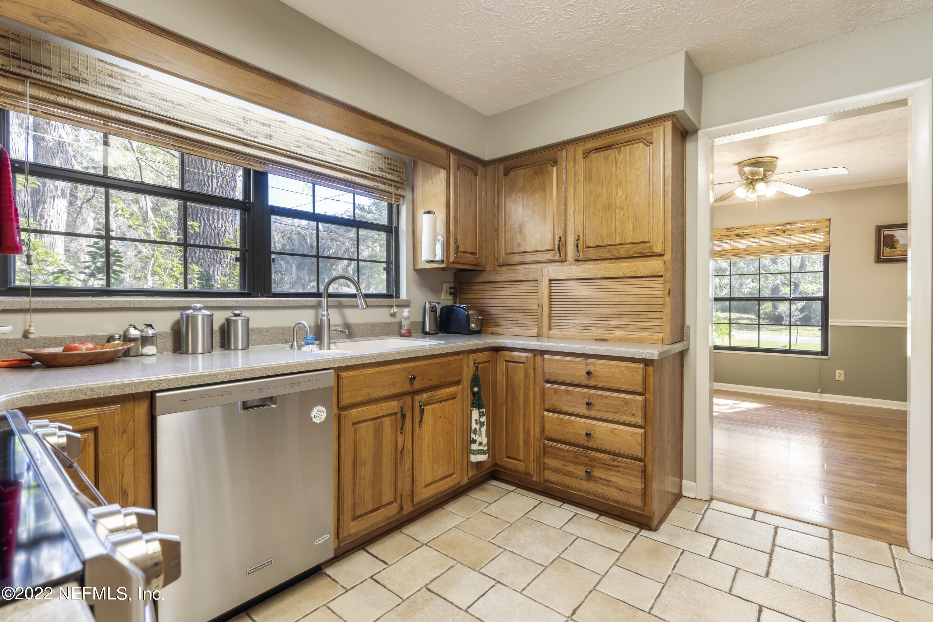 4208 Cedar Road Orange Park, FL 32065 - Photo 11 of 37 a kitchen with stainless steel appliances granite countertop a sink and cabinets
