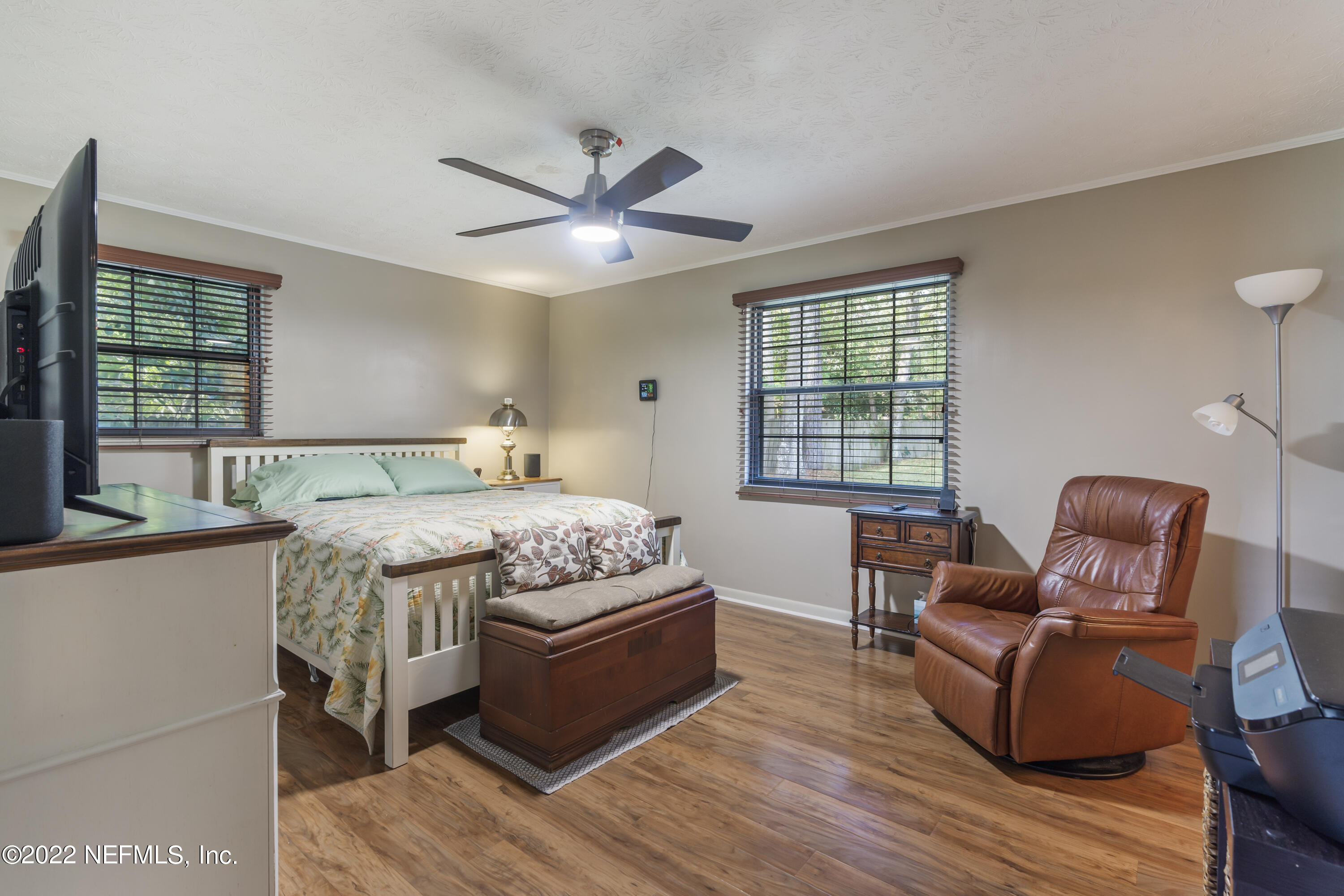 4208 Cedar Road Orange Park, FL 32065 - Photo 16 of 37 a bedroom with a bed and wooden floor