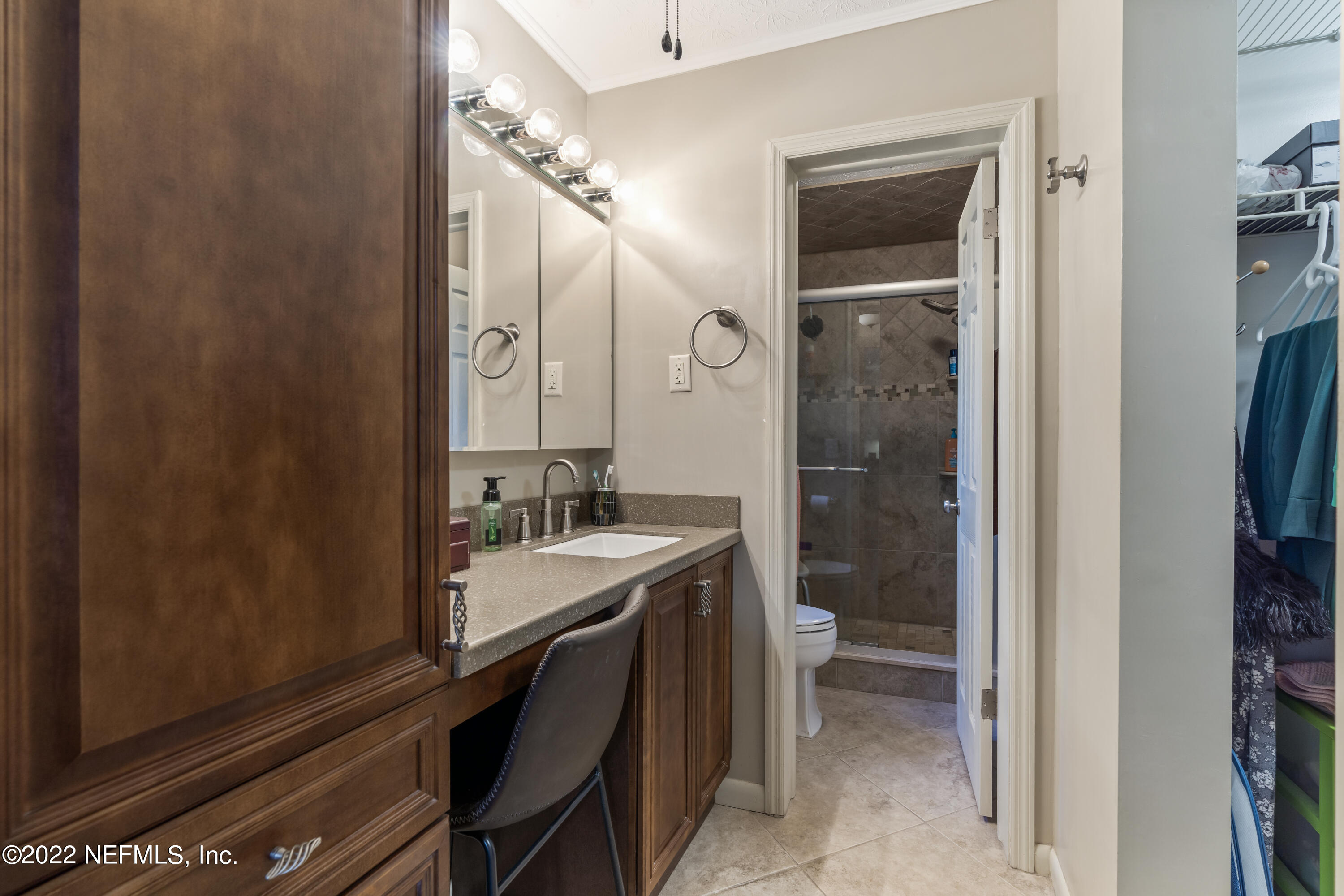 4208 Cedar Road Orange Park, FL 32065 - Photo 18 of 37 a bathroom with a double vanity sink a toilet and shower