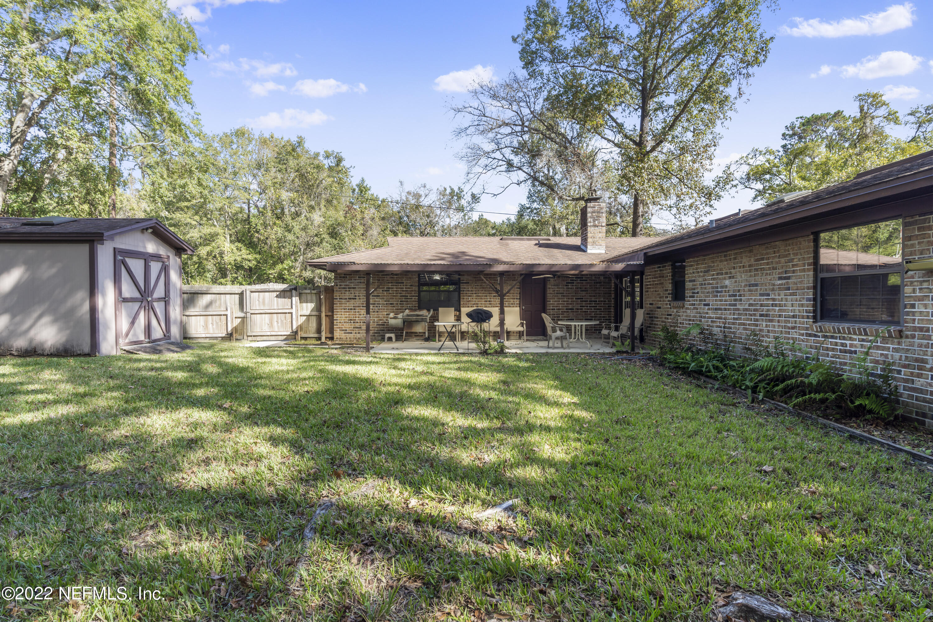 4208 Cedar Road Orange Park, FL 32065 - Photo 30 of 37 a view of a house with a yard porch and sitting area