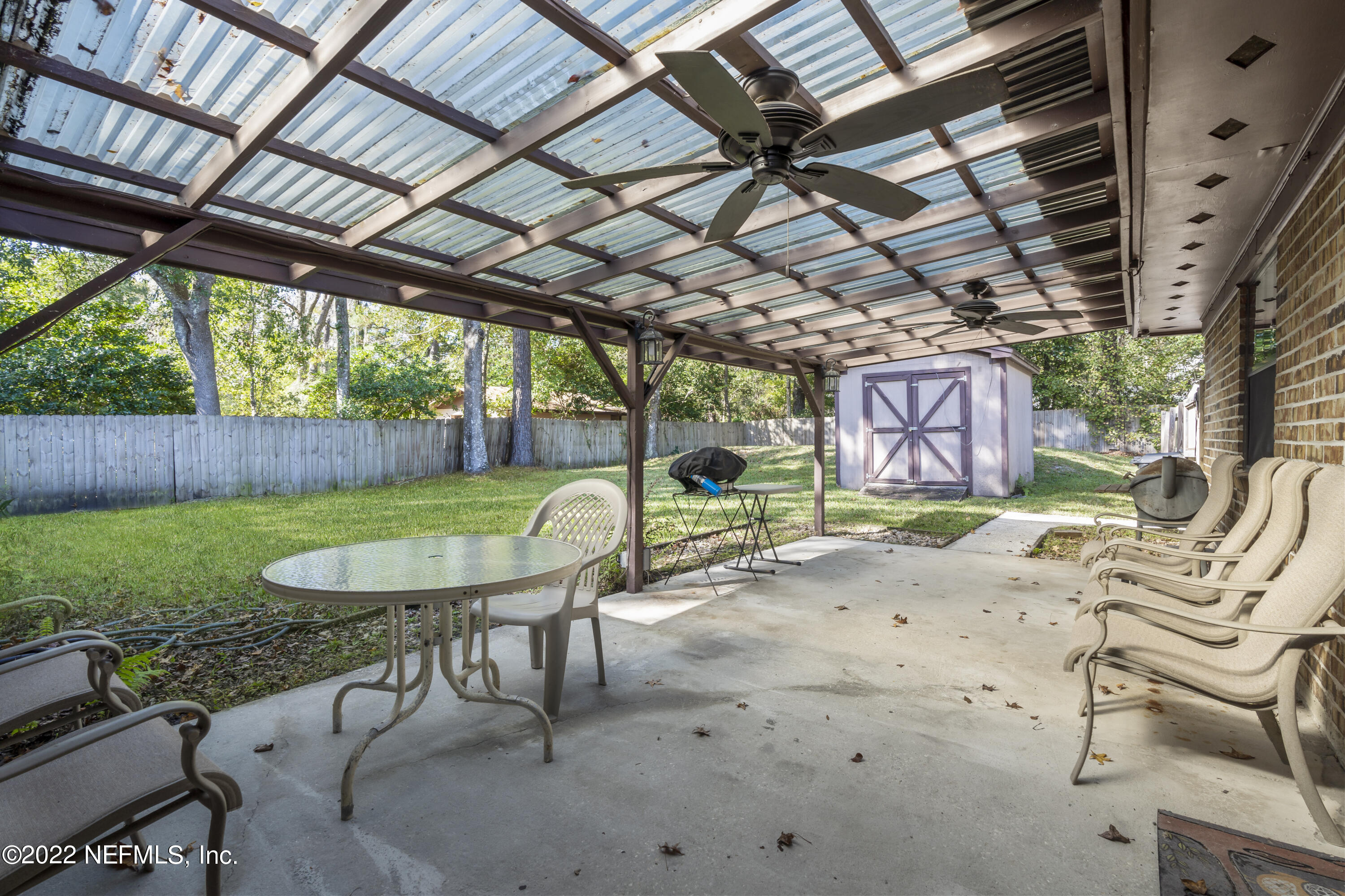 4208 Cedar Road Orange Park, FL 32065 - Photo 32 of 37 a view of a chairs and table in the patio