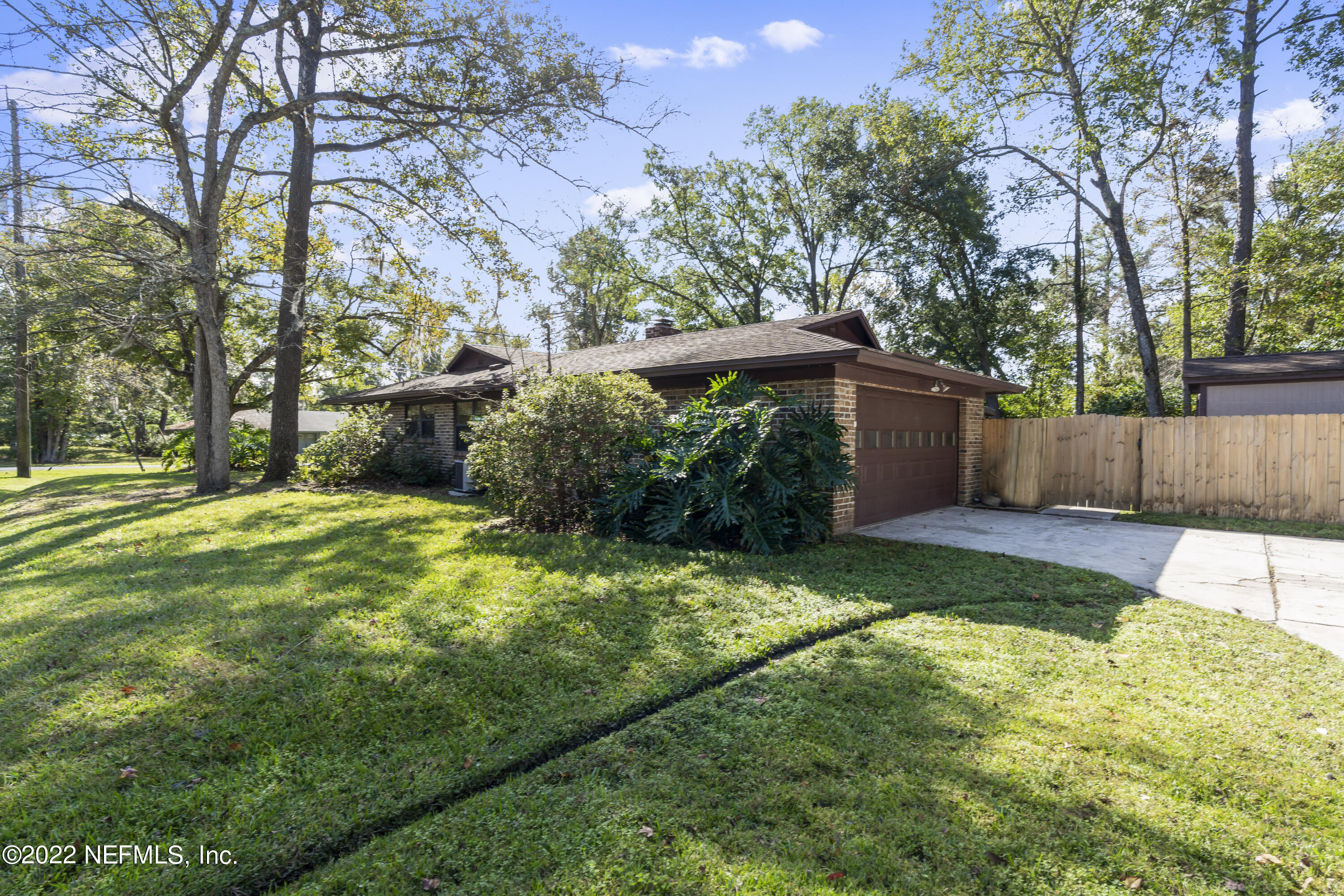 4208 Cedar Road Orange Park, FL 32065 - Photo 34 of 37 a view of a yard with a large tree