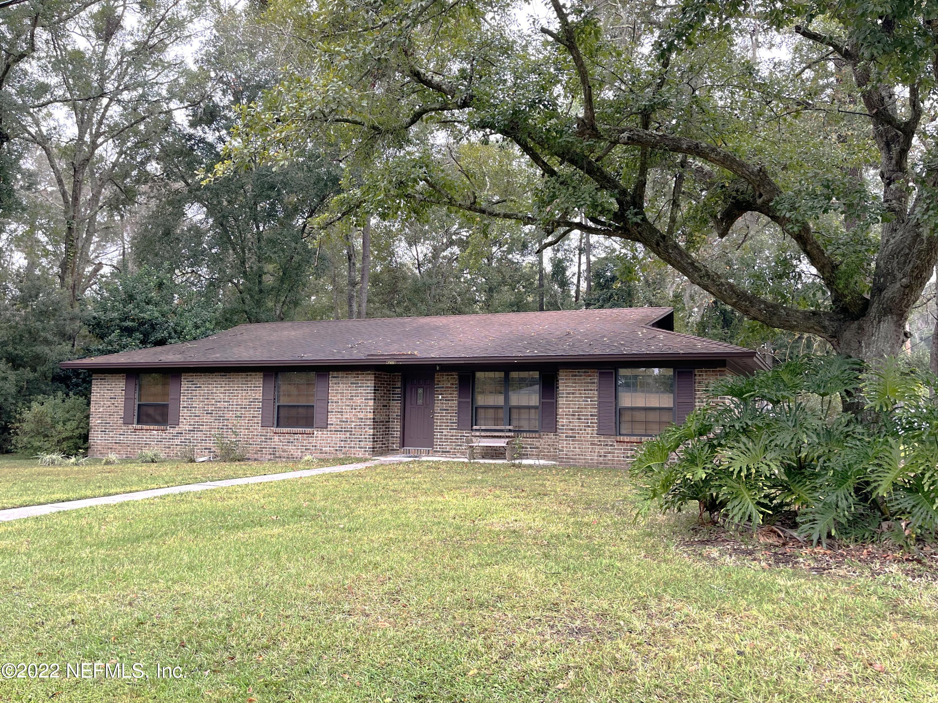 4208 Cedar Road Orange Park, FL 32065 - Photo 37 of 37 a front view of a house with a garden and plants