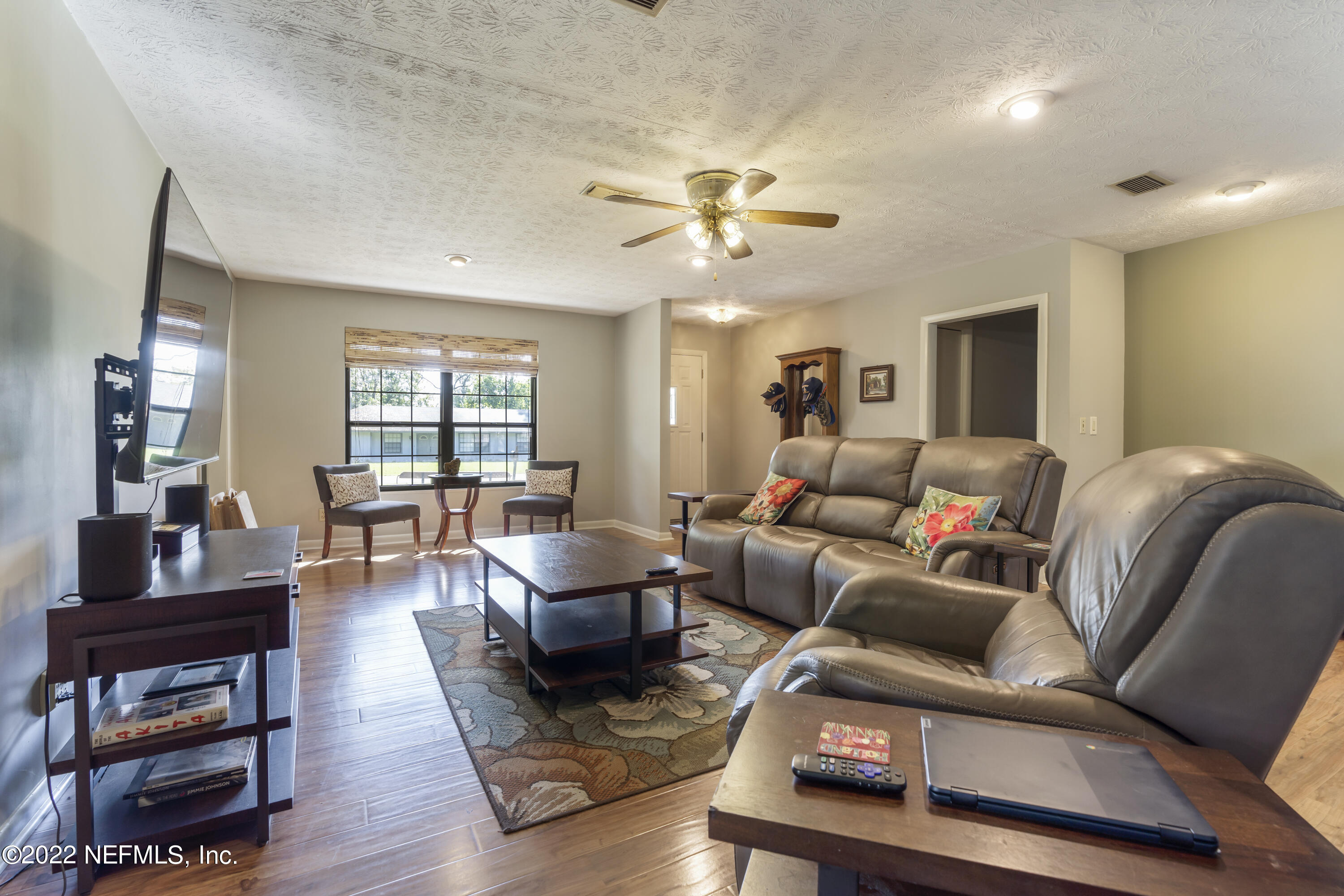 4208 Cedar Road Orange Park, FL 32065 - Photo 6 of 37 a living room with furniture and wooden floor