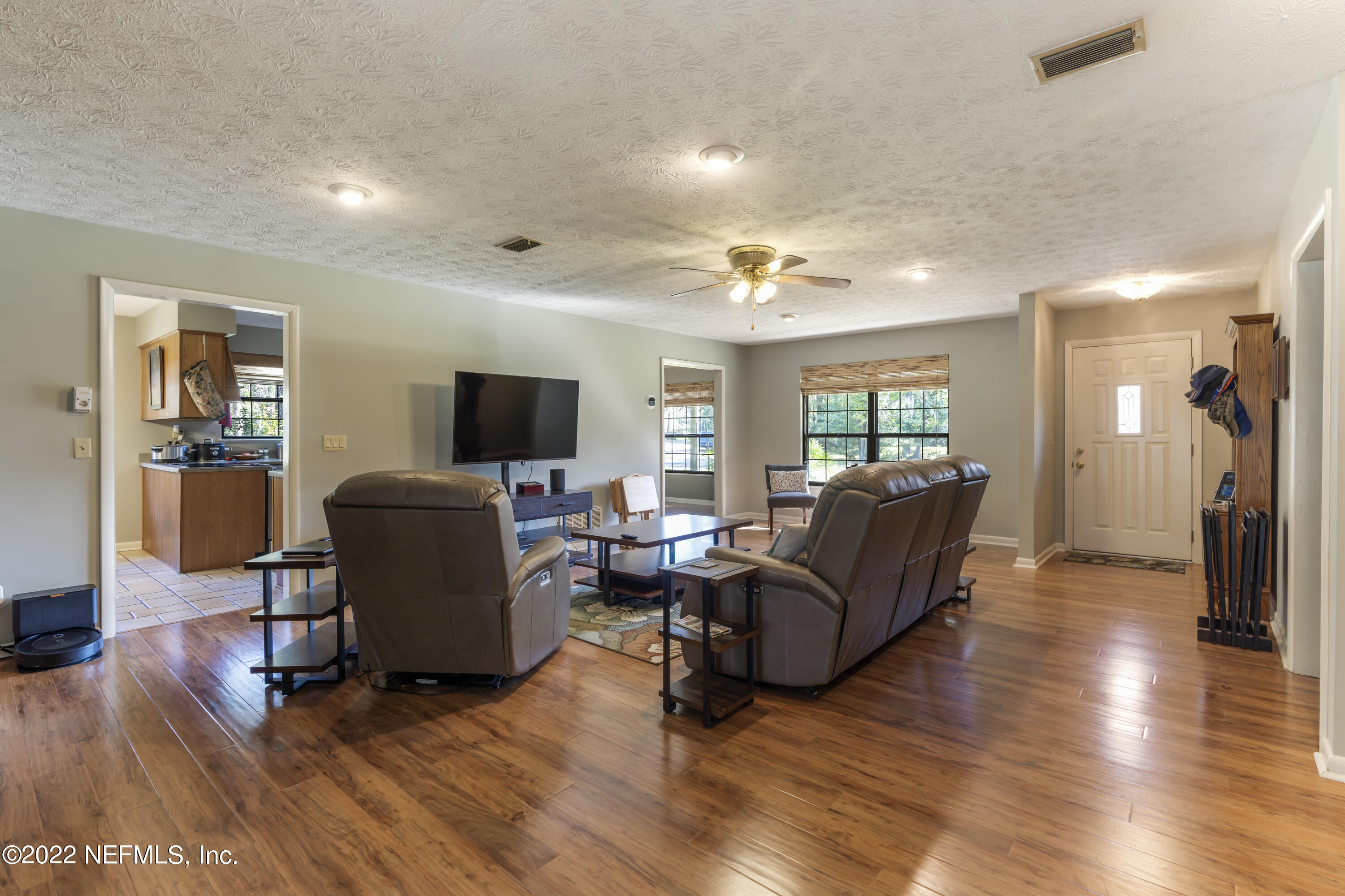4208 Cedar Road Orange Park, FL 32065 - Photo 7 of 37 a living room with furniture and a flat screen tv