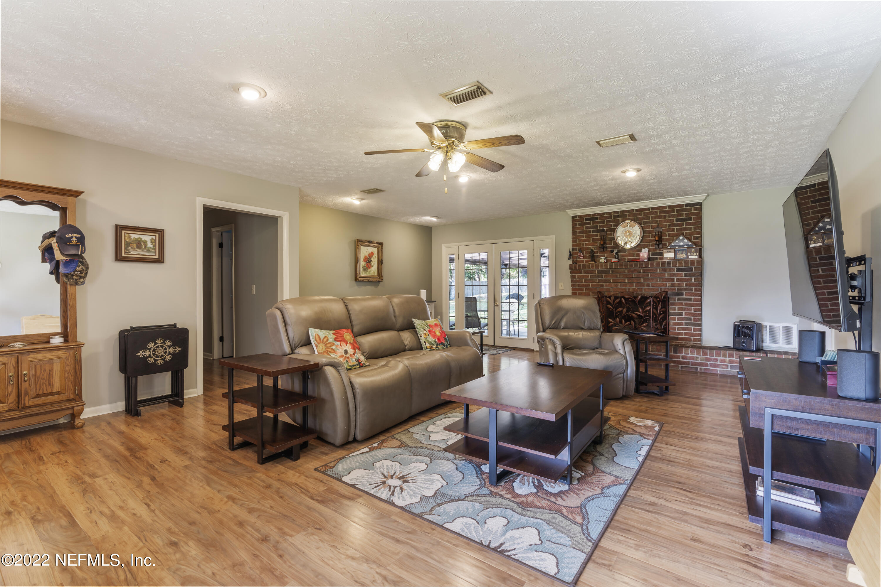 4208 Cedar Road Orange Park, FL 32065 - Photo 8 of 37 a living room with furniture and wooden floor