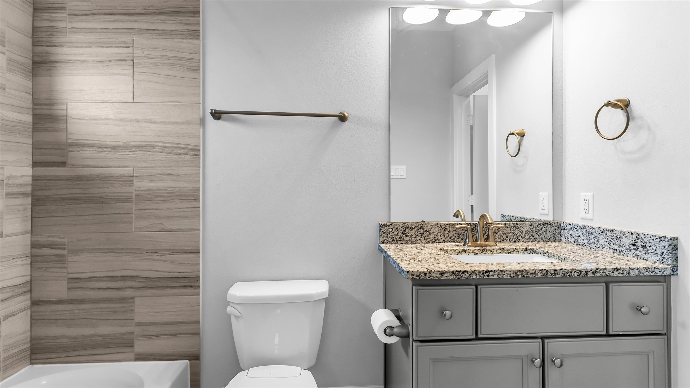 5429 Larkin Street Houston, TX 77007 - Photo 12 of 47 a bathroom with a granite countertop sink toilet and shower