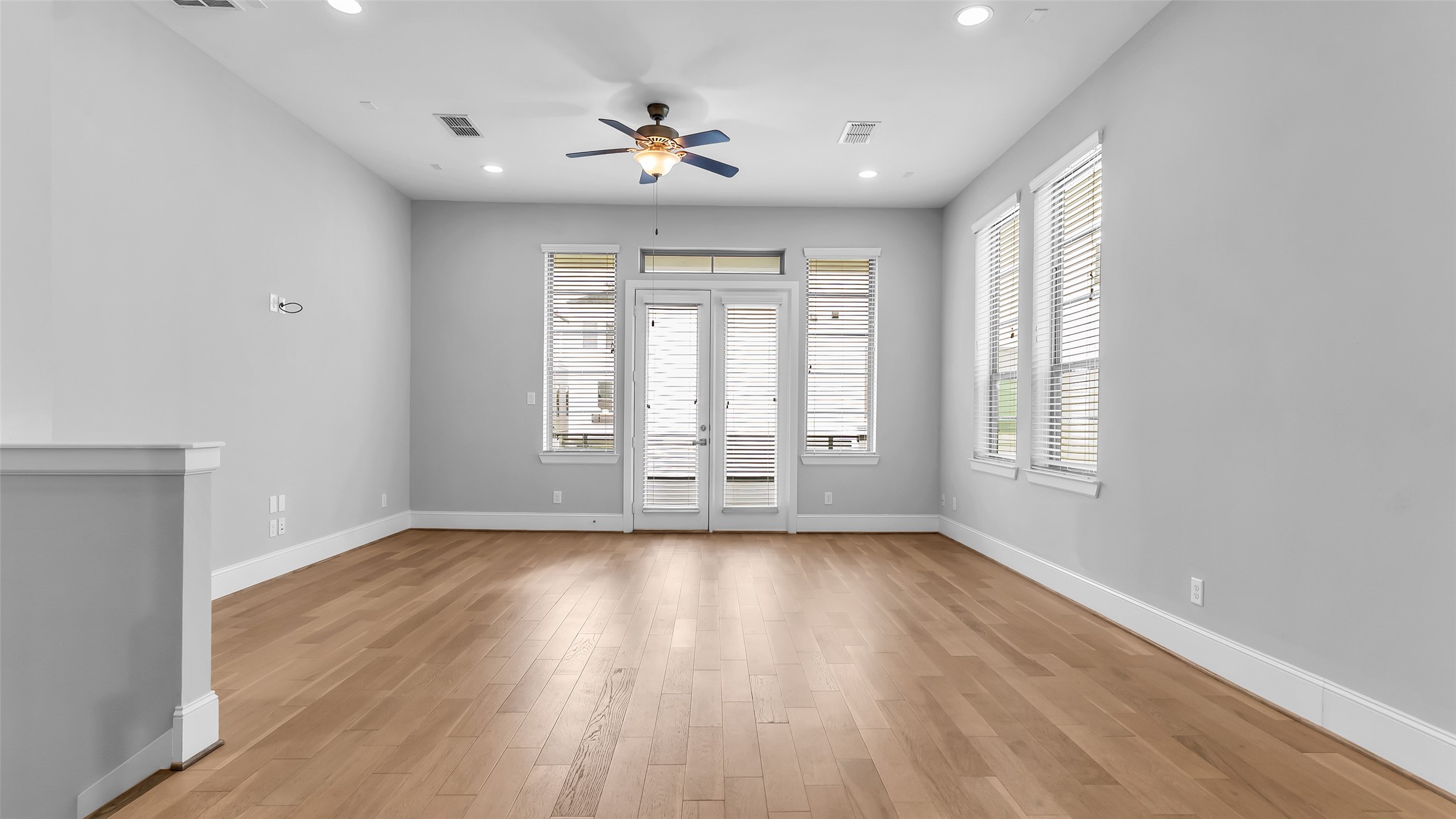 5429 Larkin Street Houston, TX 77007 - Photo 14 of 47 a view of an empty room with a window and wooden floor