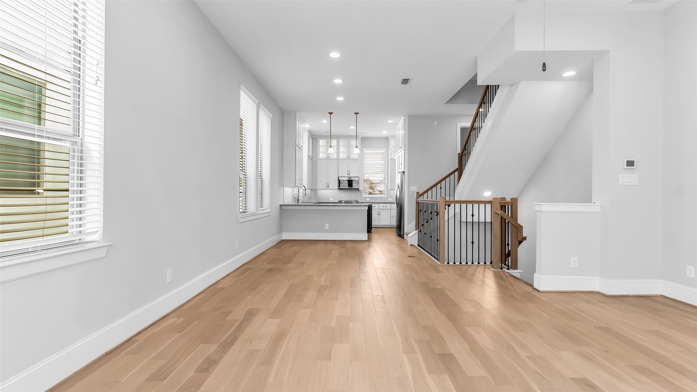 5429 Larkin Street Houston, TX 77007 - Photo 17 of 47 a view of entryway and hall with wooden floor