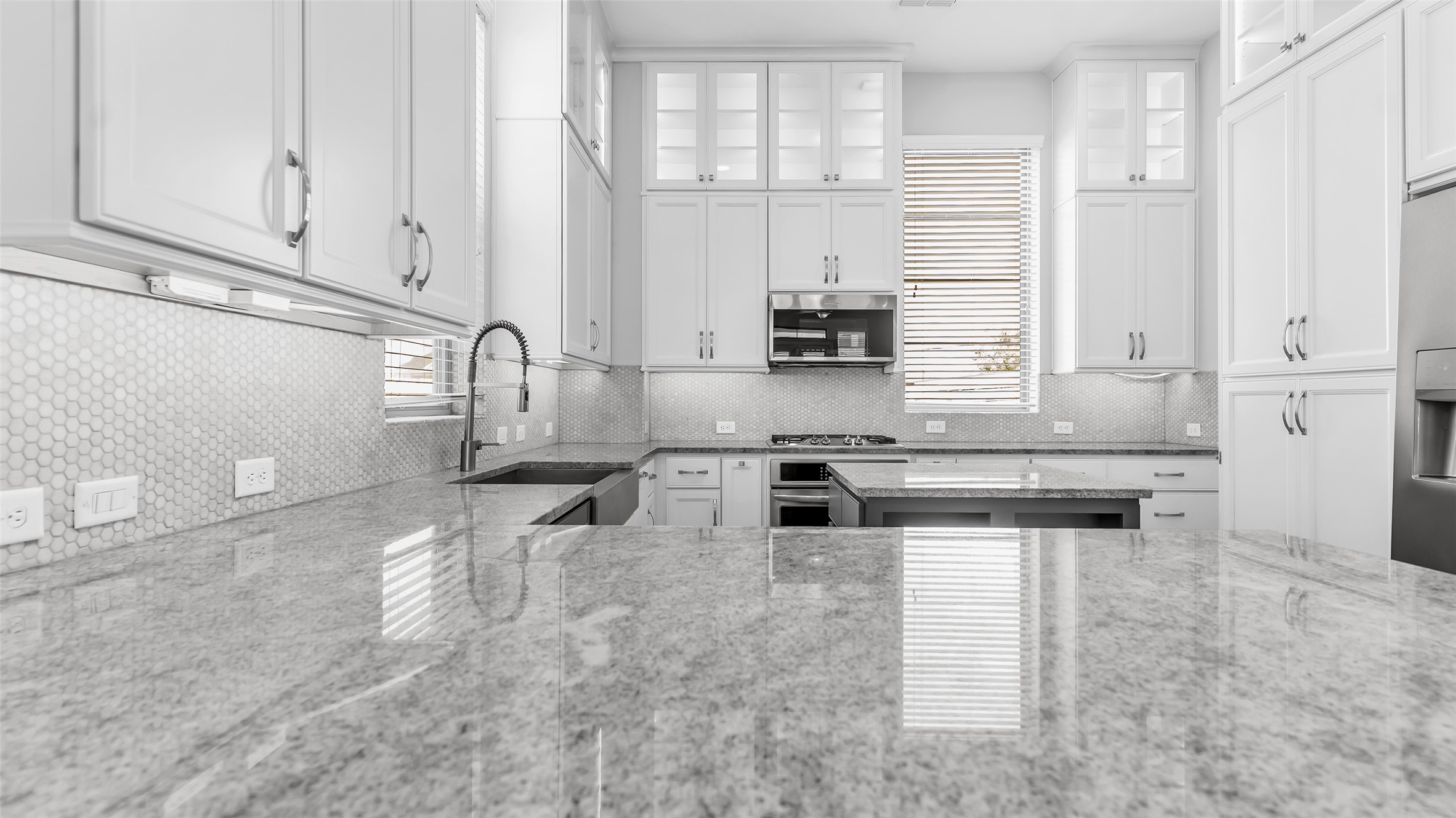 5429 Larkin Street Houston, TX 77007 - Photo 19 of 47 a kitchen with stainless steel appliances granite countertop a stove a sink and white cabinets