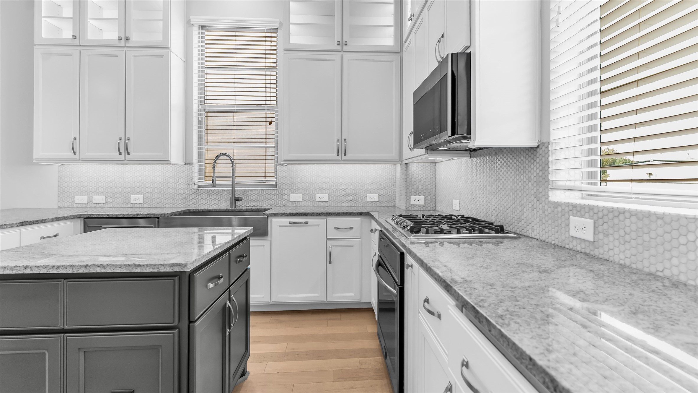 5429 Larkin Street Houston, TX 77007 - Photo 22 of 47 a kitchen with stainless steel appliances granite countertop a sink stove and microwave