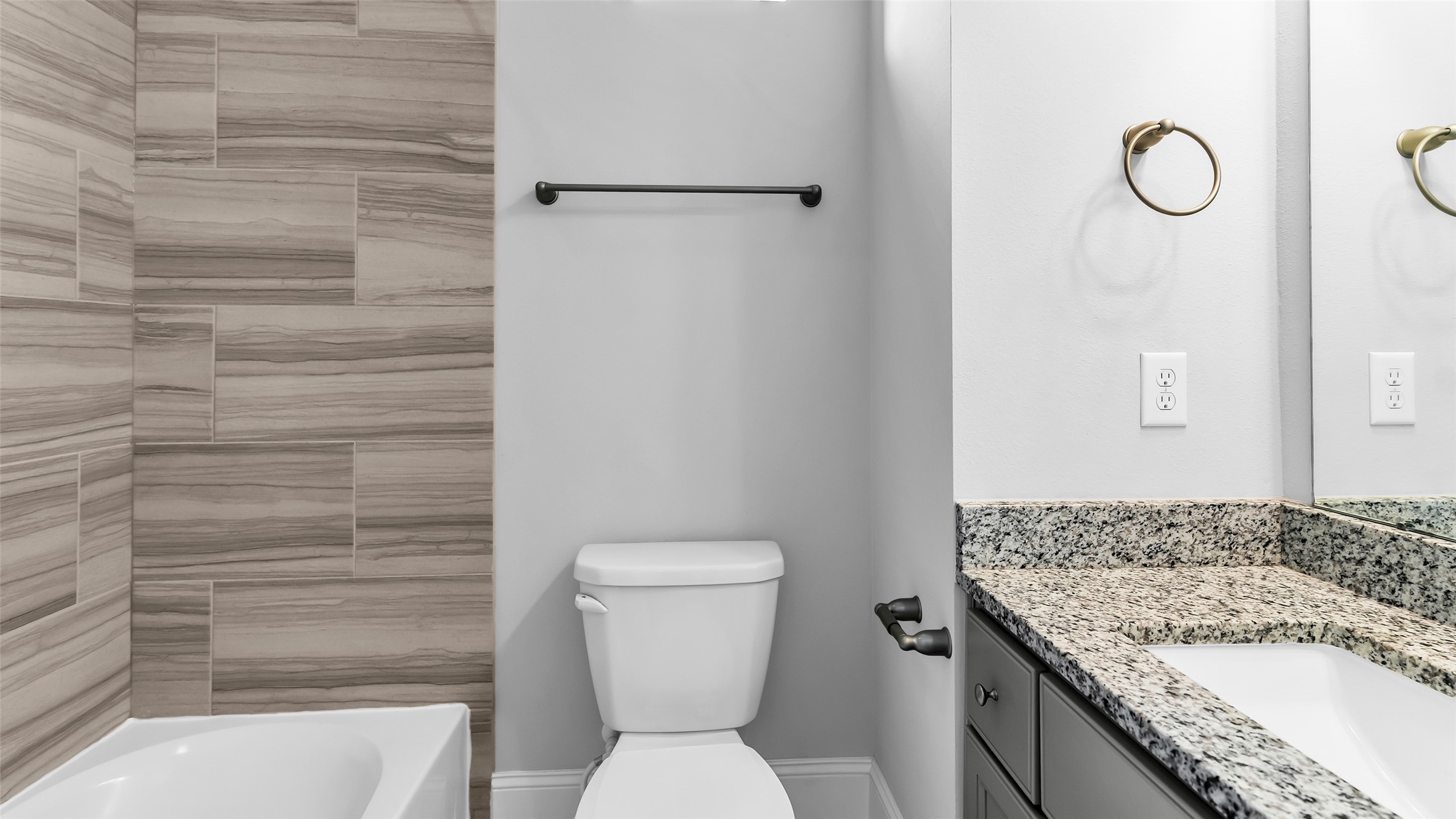 5429 Larkin Street Houston, TX 77007 - Photo 28 of 47 a bathroom with a granite countertop toilet and a shower