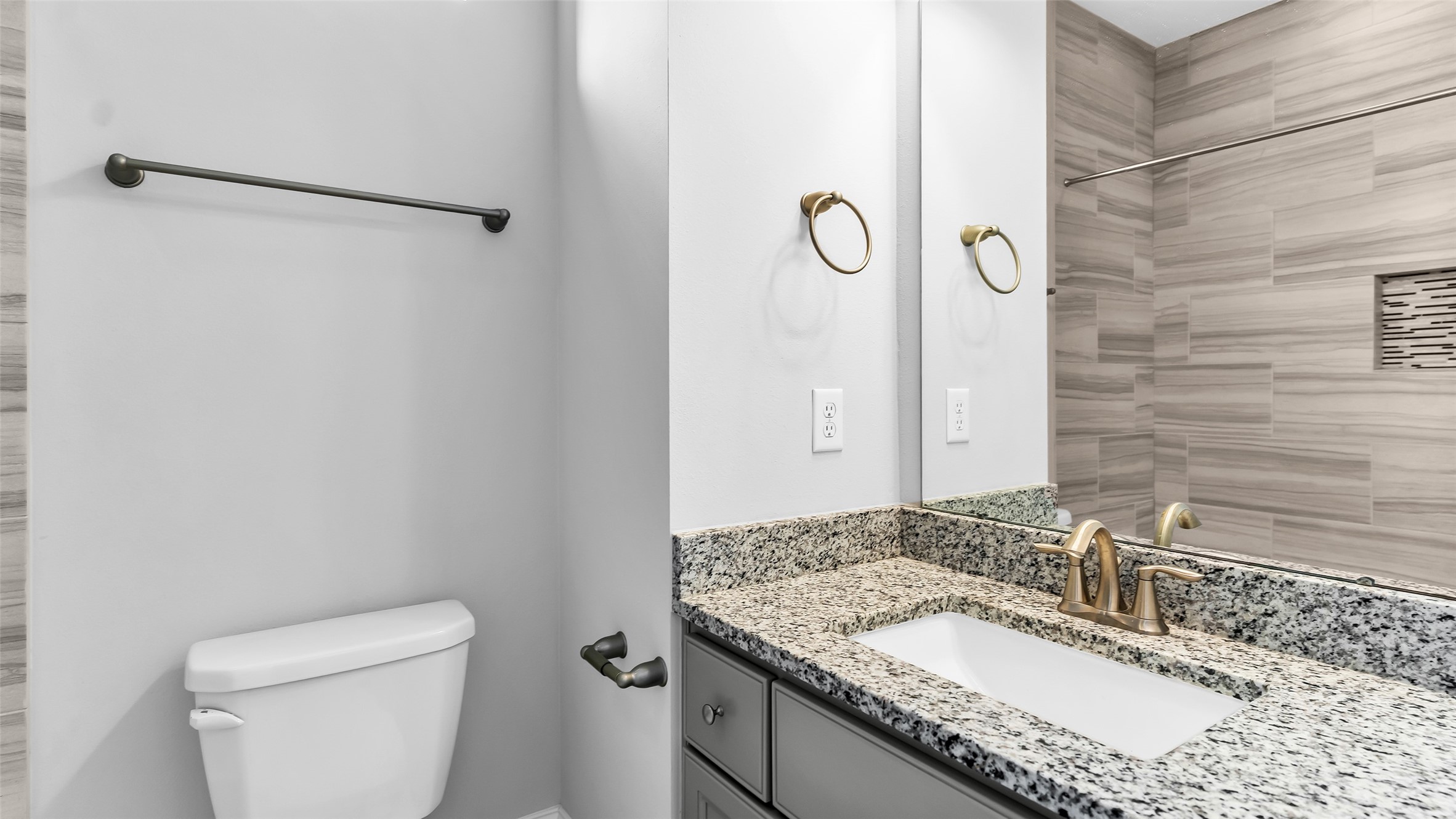 5429 Larkin Street Houston, TX 77007 - Photo 29 of 47 a bathroom with a granite countertop sink toilet and shower