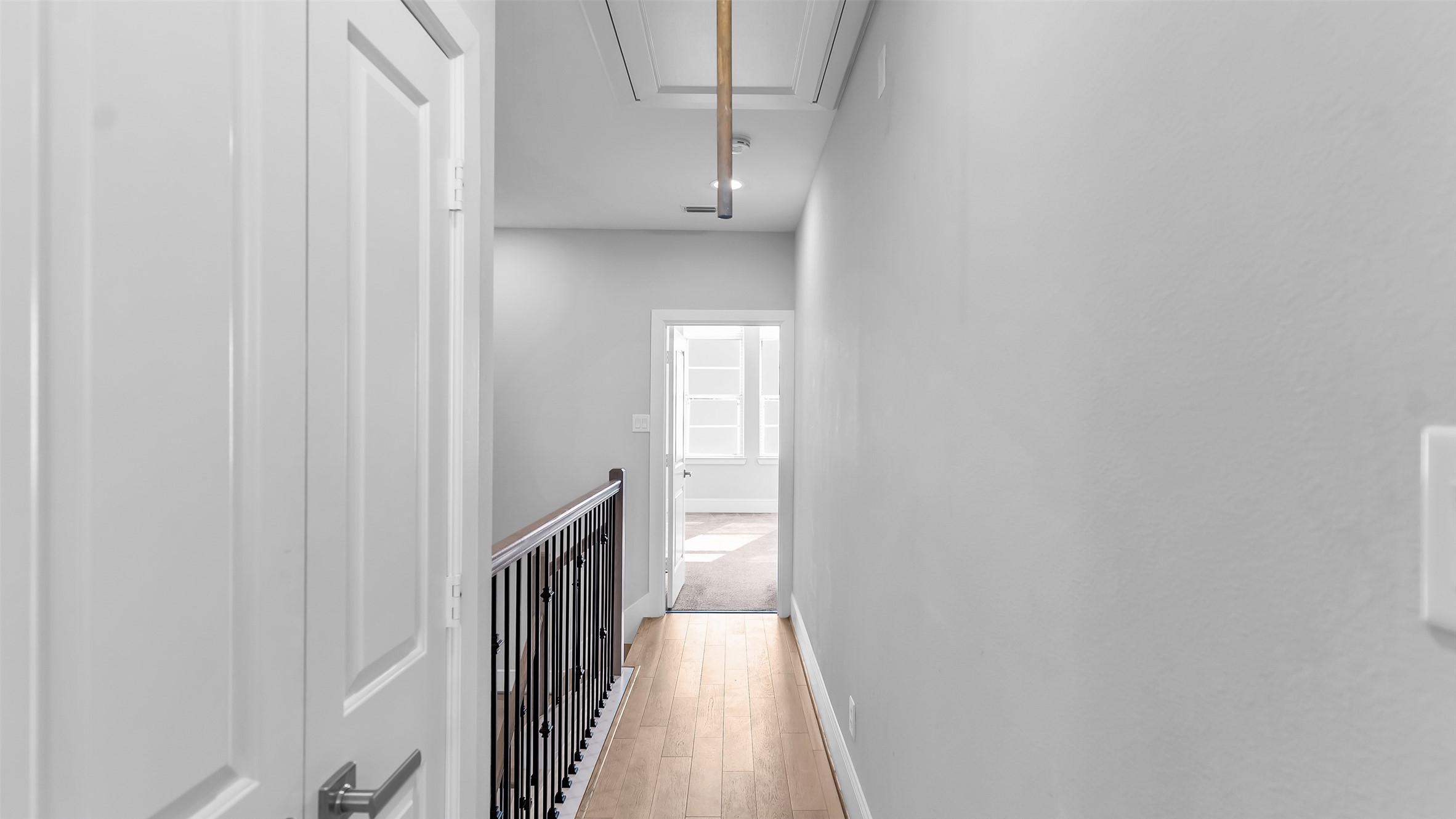 5429 Larkin Street Houston, TX 77007 - Photo 32 of 47 a view of a hallway with wooden floor and staircase