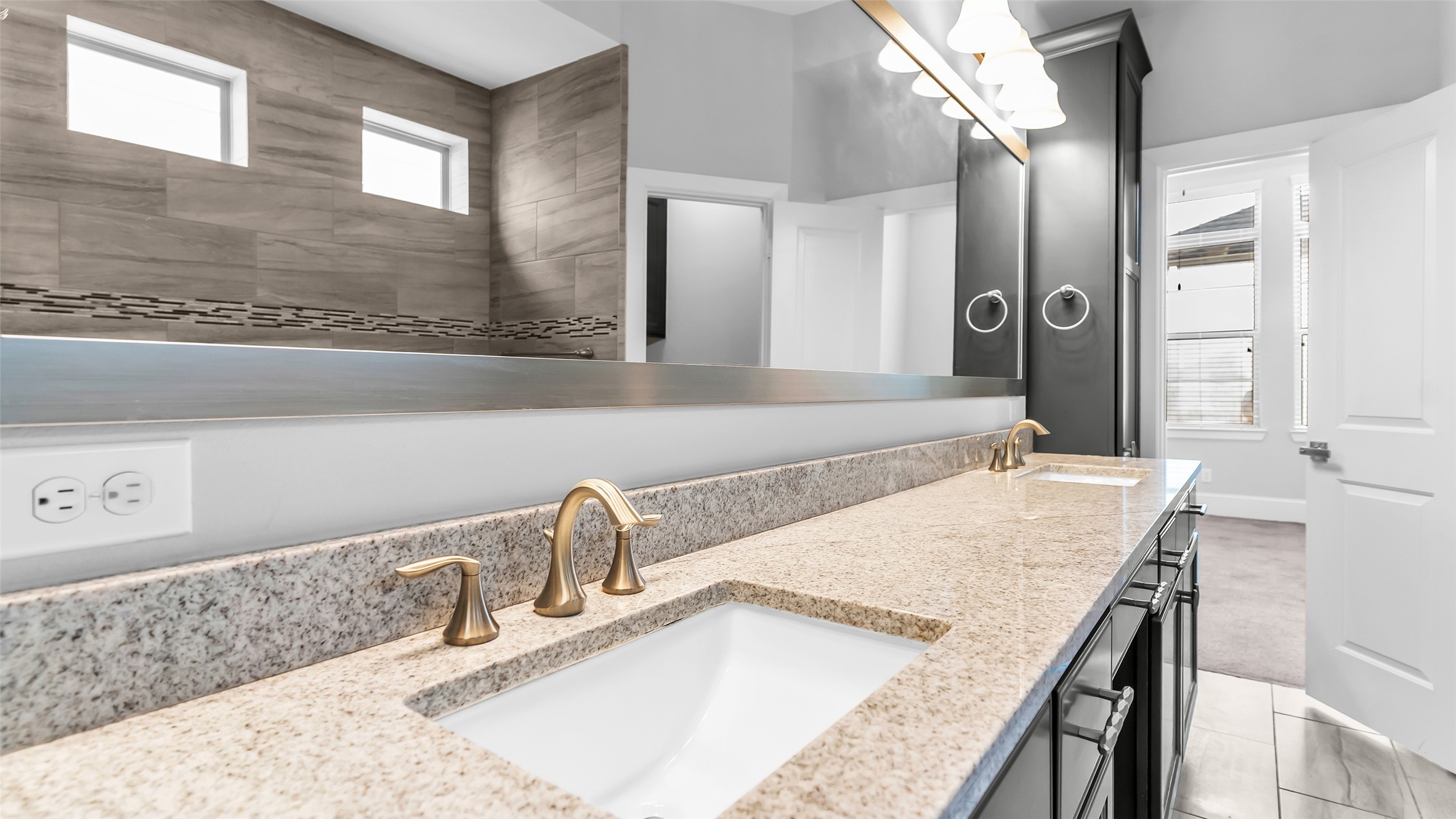 5429 Larkin Street Houston, TX 77007 - Photo 40 of 47 a bathroom with a granite countertop sink and a mirror