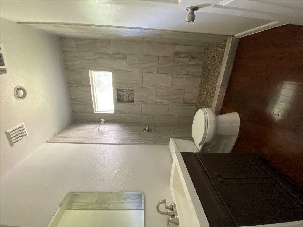 3804 Duval Street Austin, TX 78751 - Photo 15 of 21 a bathroom with a sink a toilet and shower