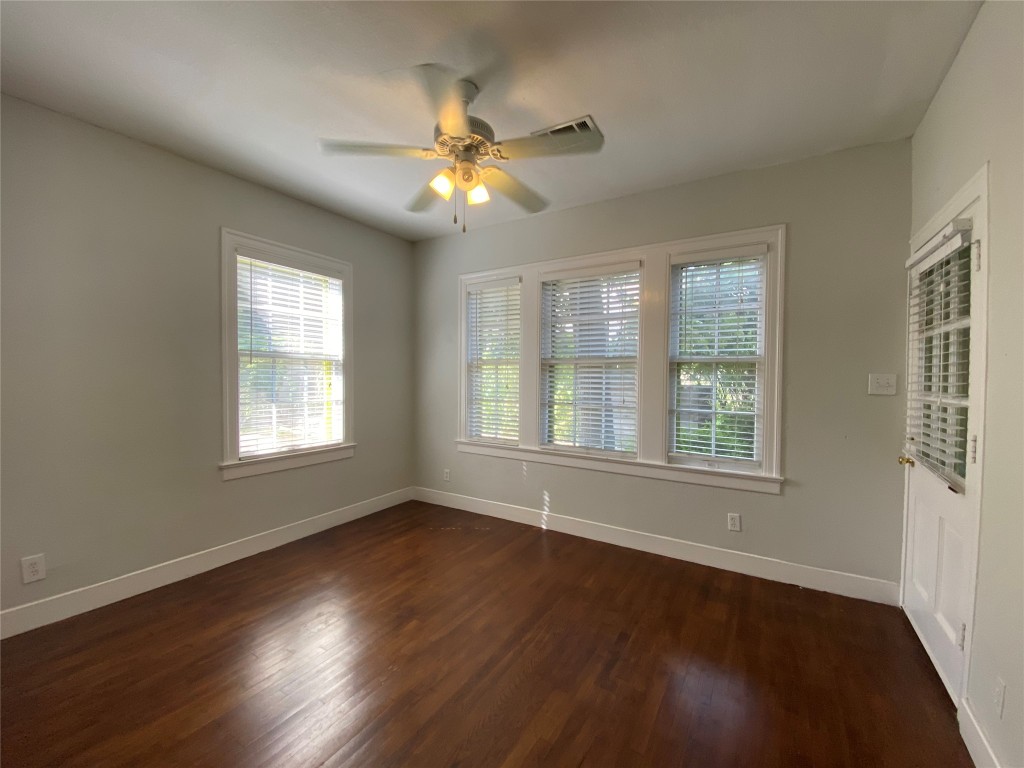 3804 Duval Street Austin, TX 78751 - Photo 20 of 21 a view of an empty room with wooden floor and a window