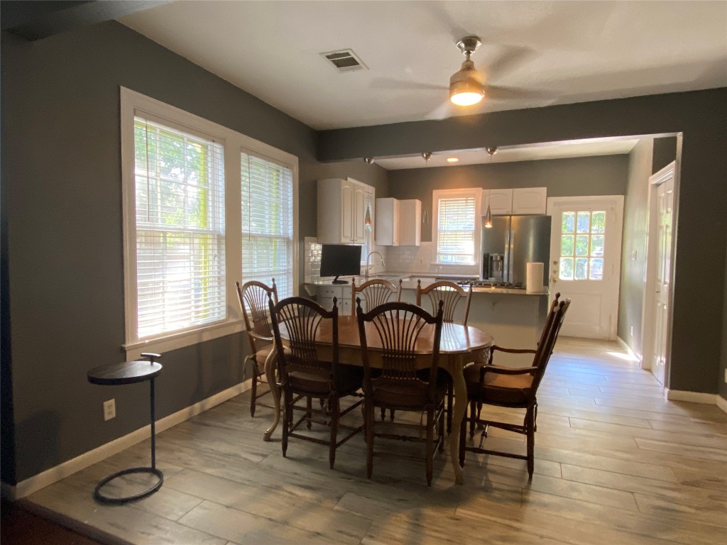 3804 Duval Street Austin, TX 78751 - Photo 3 of 21 a view of a a dining room with furniture window and wooden floor